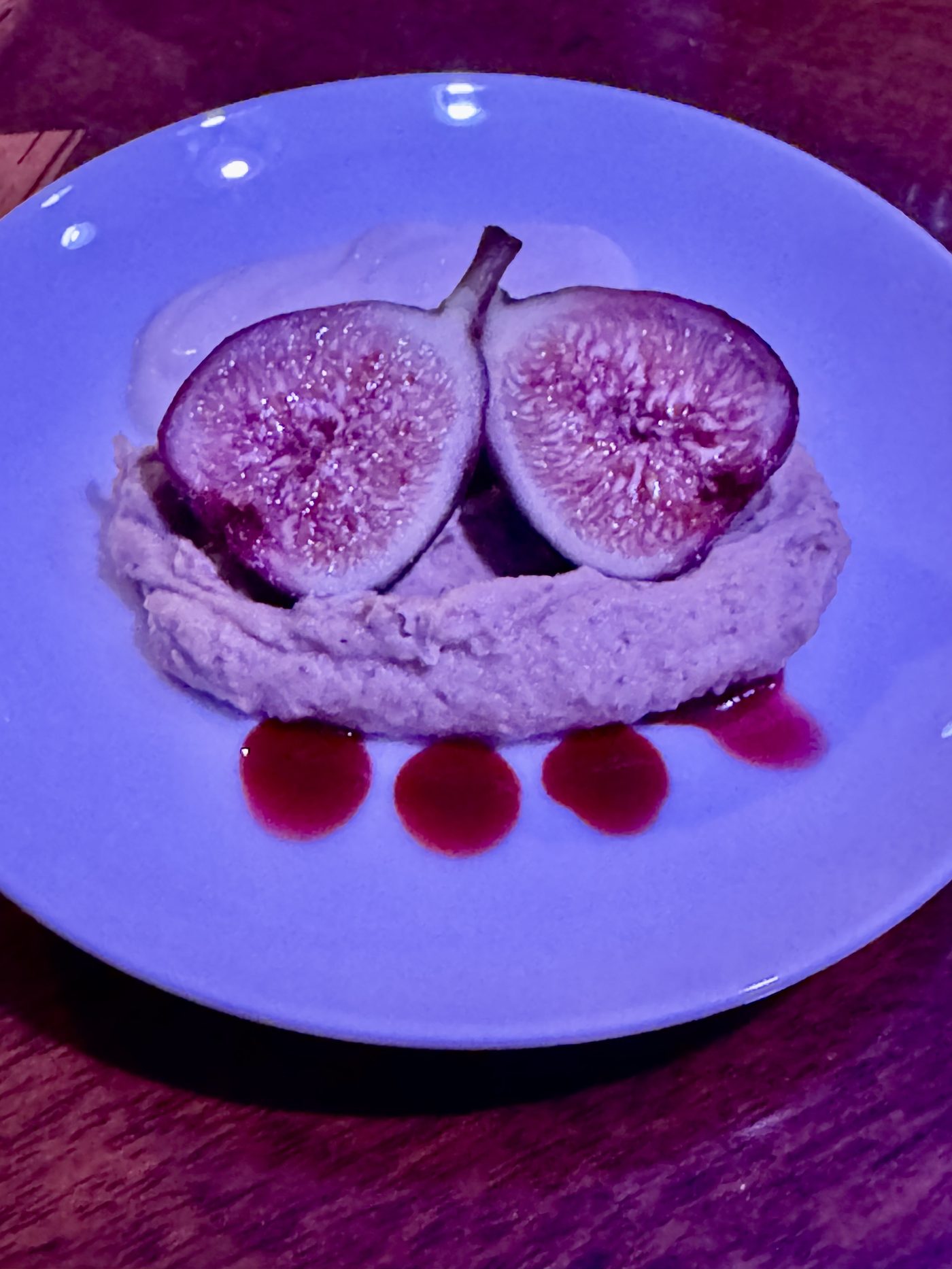 Roasted fig over whipped goat cheese with port wine reduction